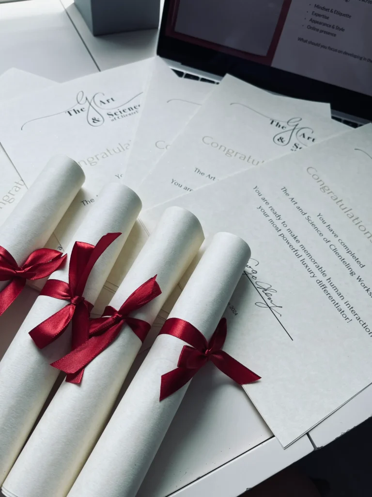 Professional certificate of participation, white design with red ribbon accent and founder's handwritten signature - The Clienteling Academy