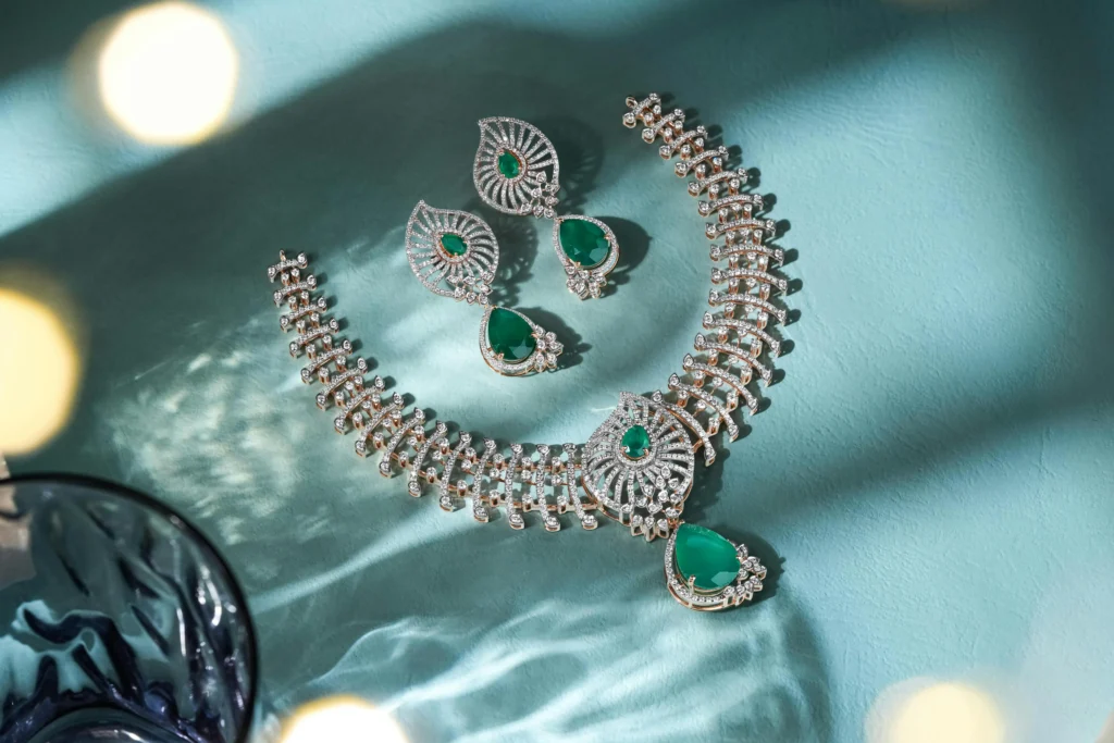 Green gemstone and diamond high-jewelry necklace on display - The Clienteling Academy